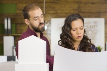team creative designers architects working near 3d printed models buildings blueprints 482257 27745